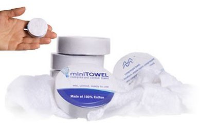 Serviette compressée 100 % coton sous la forme de